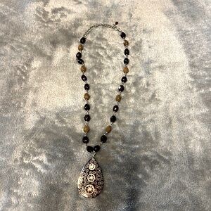 Necklace beaded with wooden tear drop